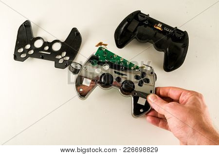 Photo Of Broken Gamepad Joystick On White Backrgound