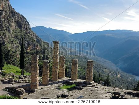 Ruins Of The Ancient Temple Of Apollo At Delphi, Overlooking The Valley Of Phocis.