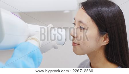Dentist taking a teeth radiography to a patien 