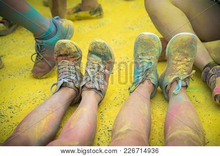 The Colorful Shoes And Legs Of Teenagers At Color Run Event