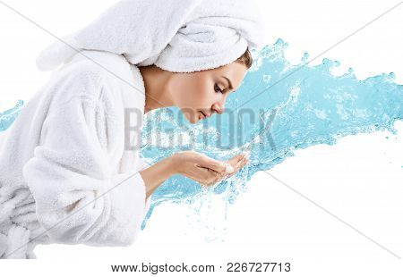 Young Woman Washing Face With Clean Water Over Water Splash Background.