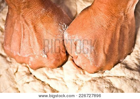 Close Up Of A Human Hand Making The Dough Of Tan Doori Roti With Maida Flour Or Cake Flour.