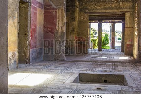 Part Of The Living Room With Frescoes Painted On The Walls In A Ruined House In Pompeii, Naples, Ita