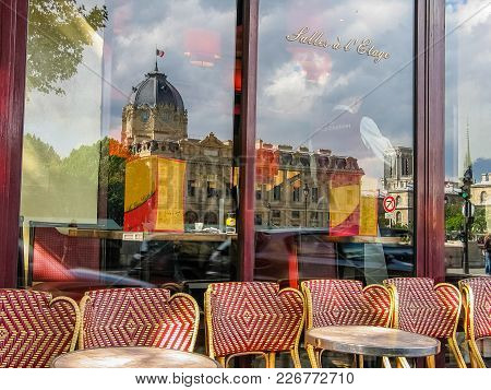 Paris, France - May 29, 2006: Cafe Au Vieux Chatelet At Seine Embankment Against Palais De Justice M