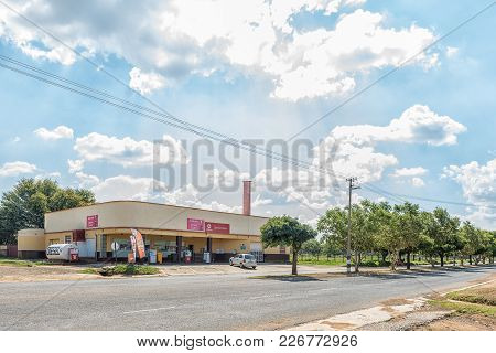 Excelsior, South Africa, February 9, 2018: A Street Scene, With Gas Station And Supermarket, In Exce