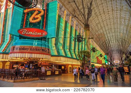Fremont Street With Many Neon Lights And Tourists In Las Vegas