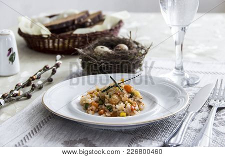 On The Table Napkin With A Plate Vegetable Stew Green Onion Glass Fork Knife And Willow Branches Sal