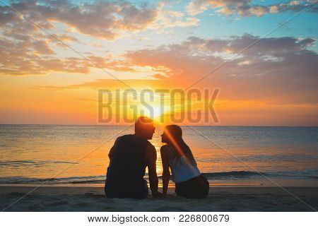 Couple On Beach At Sunset Summer Vacation, Beautiful Young People In Love Seting, Man Woman Holding 