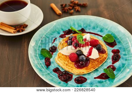 A Large Homemade Pancake With White Mascarpone Cream, Raspberries, Blueberries, Currants, Berries An
