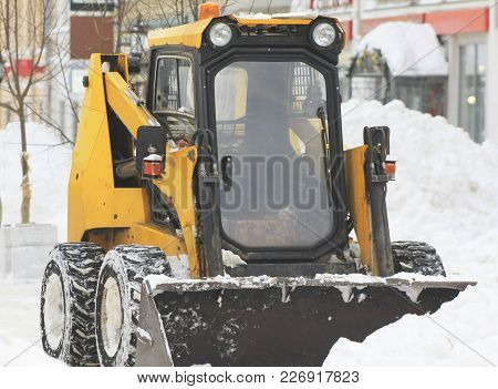 Clearing Snow From The Road With Bulldozer In The City, Urban Landscape
