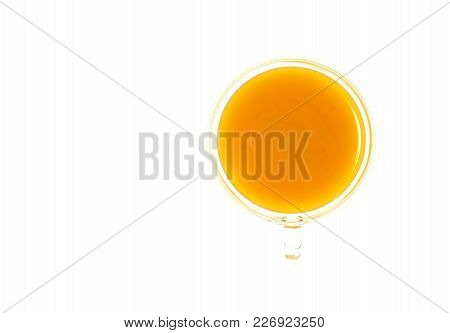 Isolate Turmeric Drink, Isolate Curcuma Tea, Top View Closeup Photo Of Glass Cup Of Yellow Turmeric/