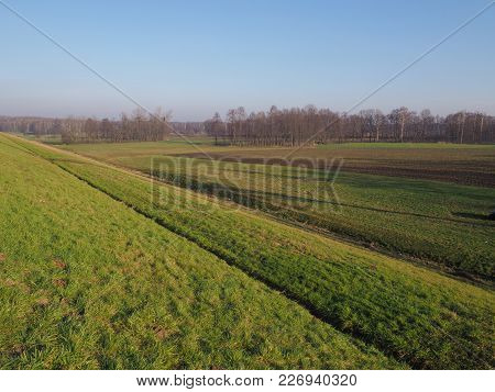 Countryside Landscapes Of Green Grassy Field Next To Artificial Goczalkowice Reservoir In Poland Wit
