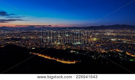 Athens Greece After The Sunset With Light Trails Of A Road In The Mountain