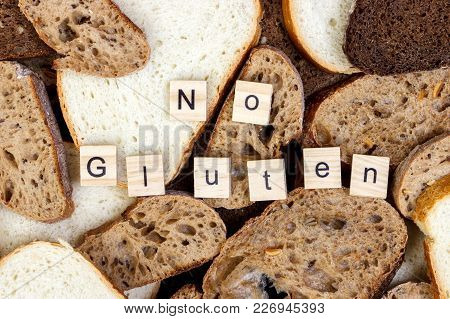 Slices Of Bread And No Gluten Sign Text Close-up.
