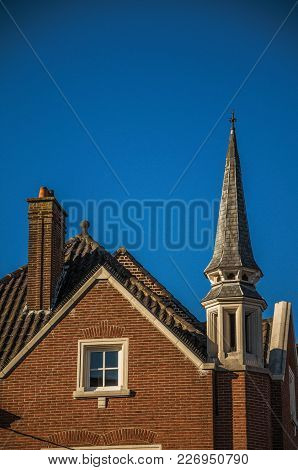 Detail Of Brick Building Facade And Roofs At Sunset In The City Center Of Tielt. Charming And Quiet 