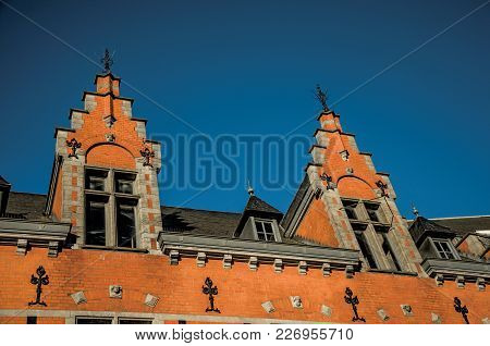 Detail Of An Old Brick Building, Roof And Windows At Sunset In Tielt. Charming And Quiet Village In 