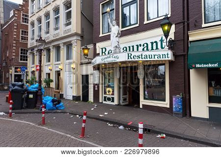 Amsterdam, Netherlands - June 25, 2017: Uncleaned Garbage On The One Of The Central Amsterdam Street