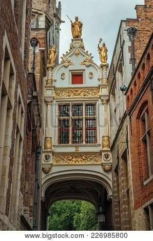 Rich And Elegant Decoration On Historic Buildings At City Center Of Bruges. With Many Canals And Old
