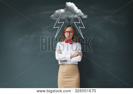 Young Woman In Bad Mood With Clouds And Rain Above Head