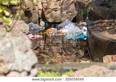 A Close Up View Of Rubbish In A Outdoor Pond