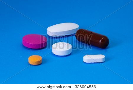 Pharmacy And Hospital Theme. Mix Of Pills And Capsules With Multivitamin And Tablets For Flu And Fev