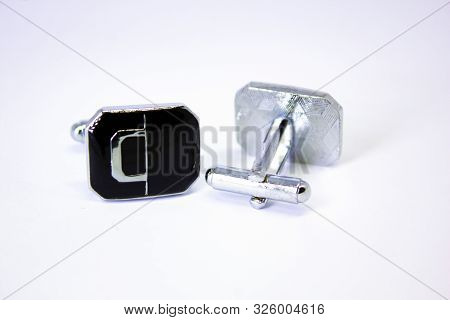 Silver Cuff Links On White Background, Close Up . Pair Of Cufflinks, Stainless Steel Cufflinks