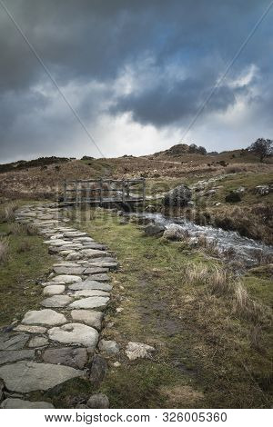 Beautiful Winter Landscape Image Looking Along Valley From Crimpiau Towards Mount Snowdon In The Dis