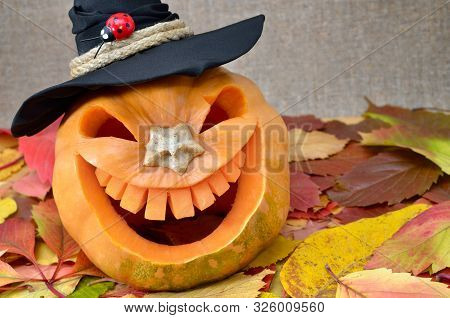 Pumpkin For Halloween Carved In The Shape Of A Smile. Jack Lantern Head Carved From Pumpkin For Hall