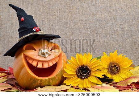 Pumpkin For Halloween Carved In The Shape Of A Smile. Jack Lantern Head Carved From Pumpkin For Hall