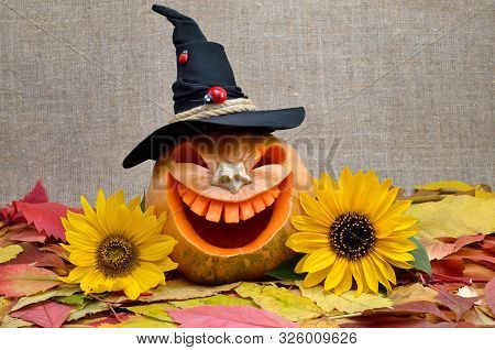 Pumpkin For Halloween Carved In The Shape Of A Smile. Jack Lantern Head Carved From Pumpkin For Hall
