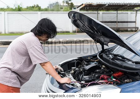 Woman Unhappy And Dismal From Car Engine Problem