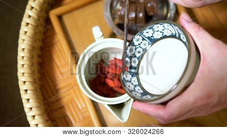 Traditional Chinese Tea Ceremony. Goji Berry Tea And Dessert.