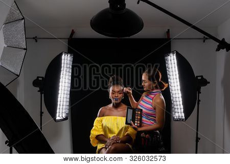 Professional Make Up Artist Working With African Fashion Model At Photo Studio With Many Equipment F