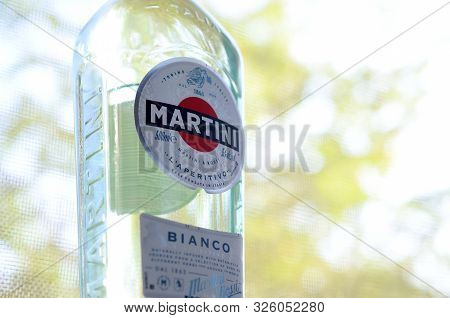 Kharkov, Ukraine - September 23, 2019: Bottle Of Vermouth Martini Rossi Close Up Logo On A Green Tre