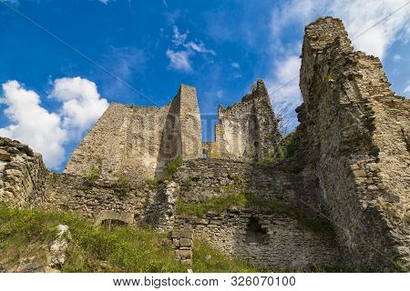 Scenic Ruins Of Ancient Castle  Likava Outside On Blue Cloudy Sky Background. Liptov Region. Slovaki