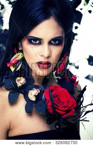 Pretty Brunette Woman With Rose Jewelry, Black And Red, Bright Make Up Kike A Vampire Closeup Red Li