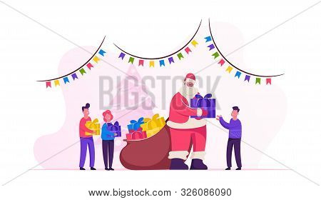 Santa Claus Character Giving Gifts To Happy Children On School Or Kindergarten Matinee Standing In R