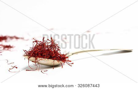 Saffron Spice Tea Crop On A Spoon On White
