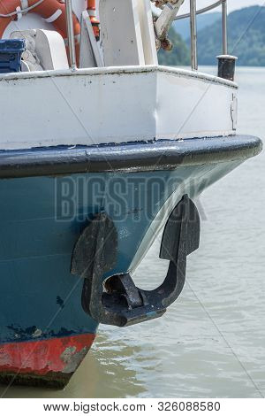 Anchor And Lifebuoy At The Bow Of A Ship - Closeup
