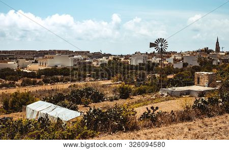 Hill With Terraced Fields For Agriculture And Old Buildings In Ghajnsielem, Gozo Island, Malta