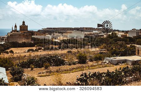 Hill With Terraced Fields For Agriculture And Old Buildings In Ghajnsielem, Gozo Island, Malta