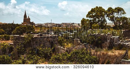 Hill With Terraced Fields For Agriculture And Old Buildings In Ghajnsielem, Gozo Island, Malta