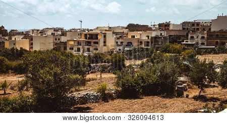Hill With Terraced Fields For Agriculture And Old Buildings In Ghajnsielem, Gozo Island, Malta