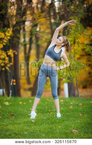 Fitness. Athlete Girl, Thlete Exercise At Outside, Woman Fitness. Young Beautiful Woman Stretching I