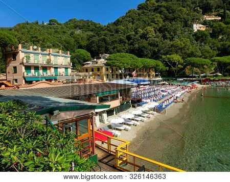 The Sand Beach Known As Paraggi Near Portofino In Genoa On A Blue Sky And Sea Background
