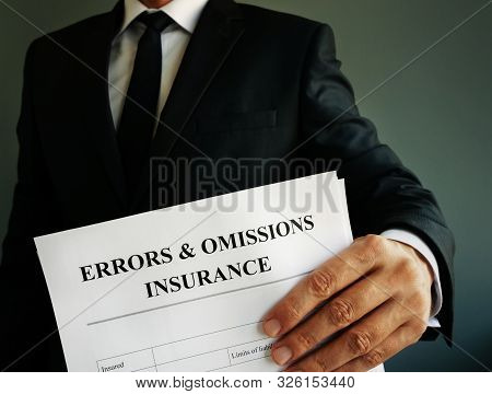 Errors And Omissions E&o Insurance Or Professional Liability Policy In The Hands.