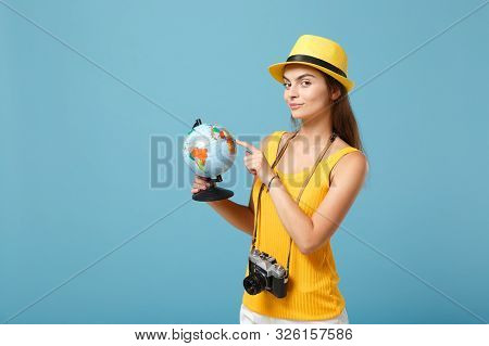 Traveler Tourist Woman In Yellow Summer Casual Clothes, Hat With Globe, Camera Isolated On Blue Back