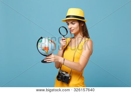 Traveler Tourist Woman In Yellow Summer Casual Clothes, Hat With Globe, Camera Isolated On Blue Back