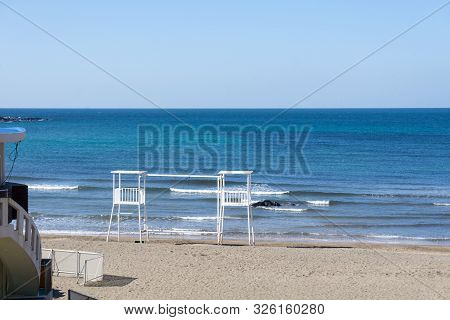 White Lifeguard Chairs At The Iho Tewoo Beach, Korea