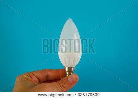 Idea Concept. Blue Background. Lamp Bulb. Copy Space